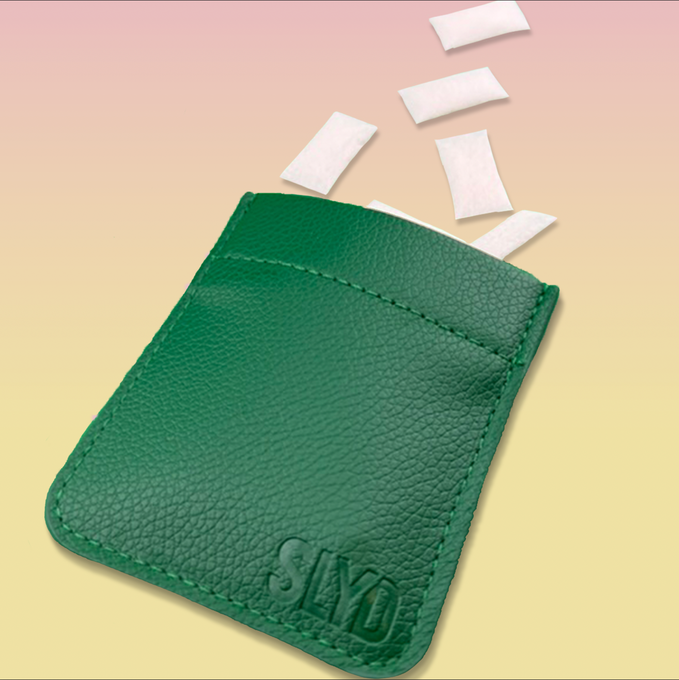 Green leather cardholder with 'Slyde' branding on a beige background